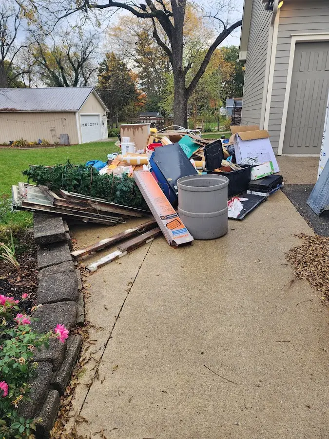 Dumpster being loaded with debris for 12 Yard Dumpster Rental in Fairfield Plantation
